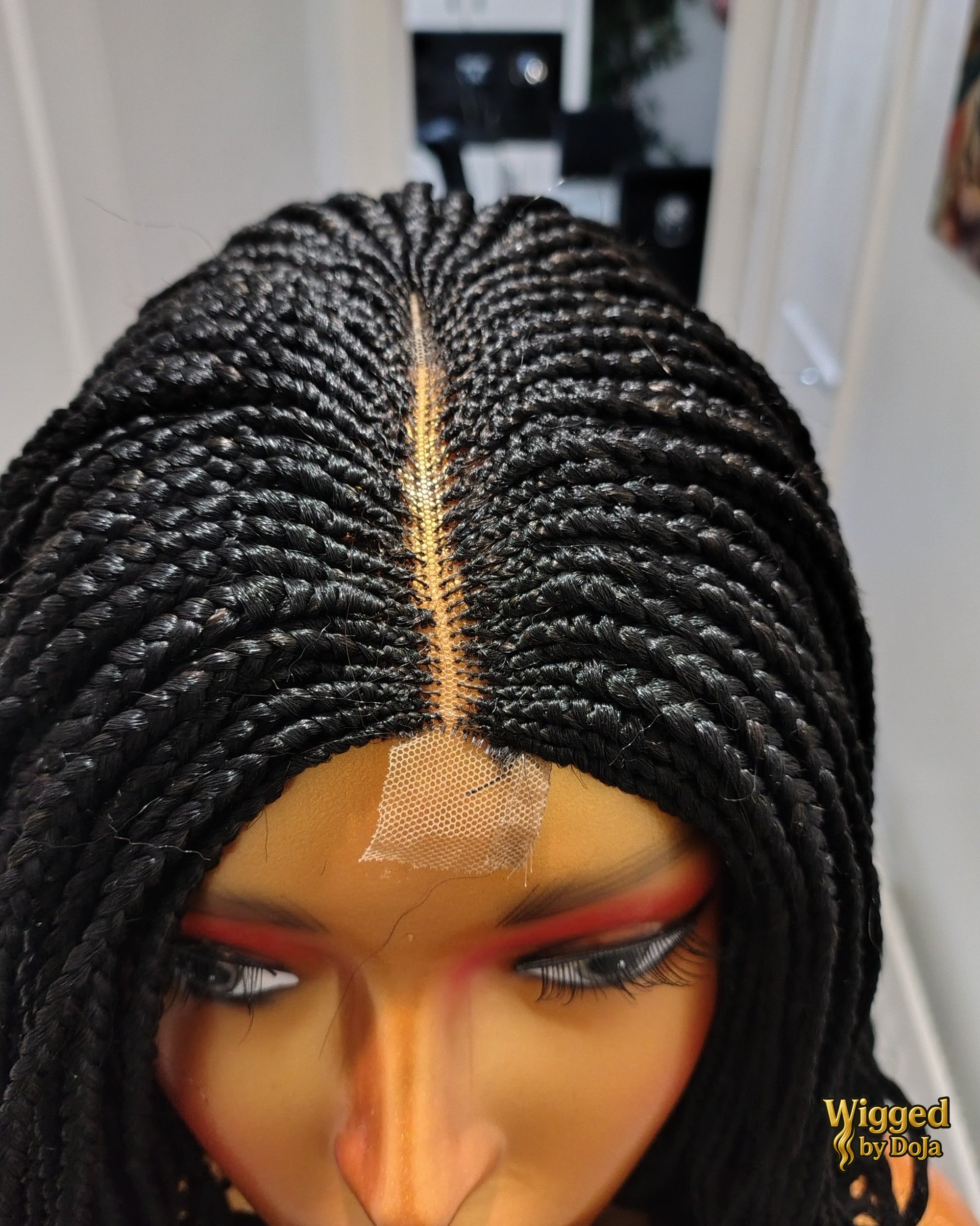 Fii centre part cornrow braids